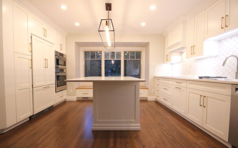 White kitchen project. Custom cabinetry with integrated LED undercabinet lights, quartz countertops, Fisher Paykel appliances and stained oak floor in Ottawa by Renovation to Renovation to Perfection.